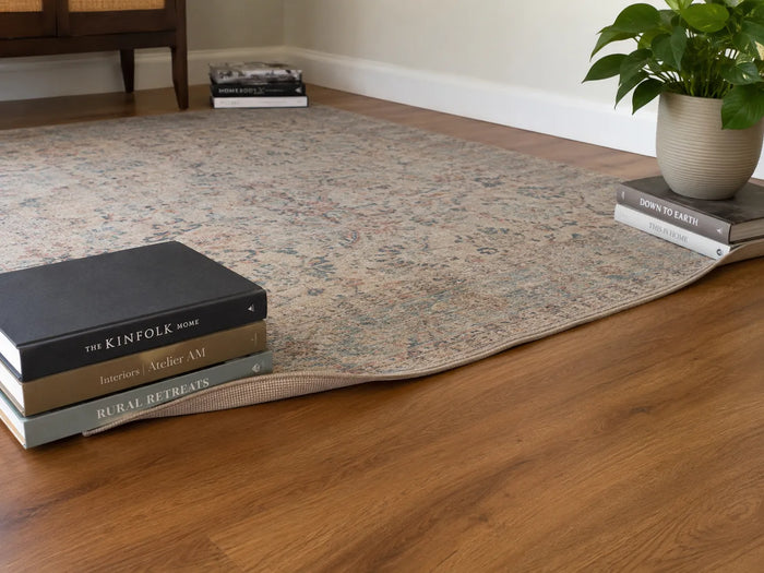Unrolling a new patterned area rug with one corner curling up
