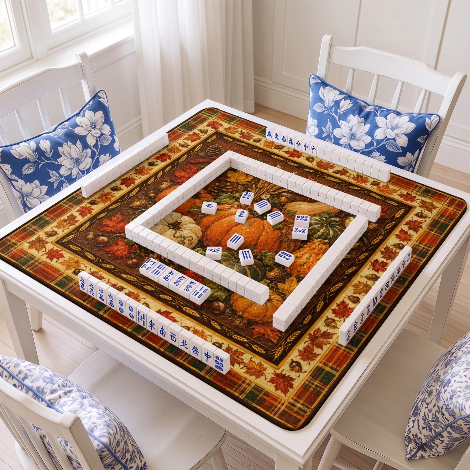 Autumn Harvest mahjong mat with tiles and racks on the table