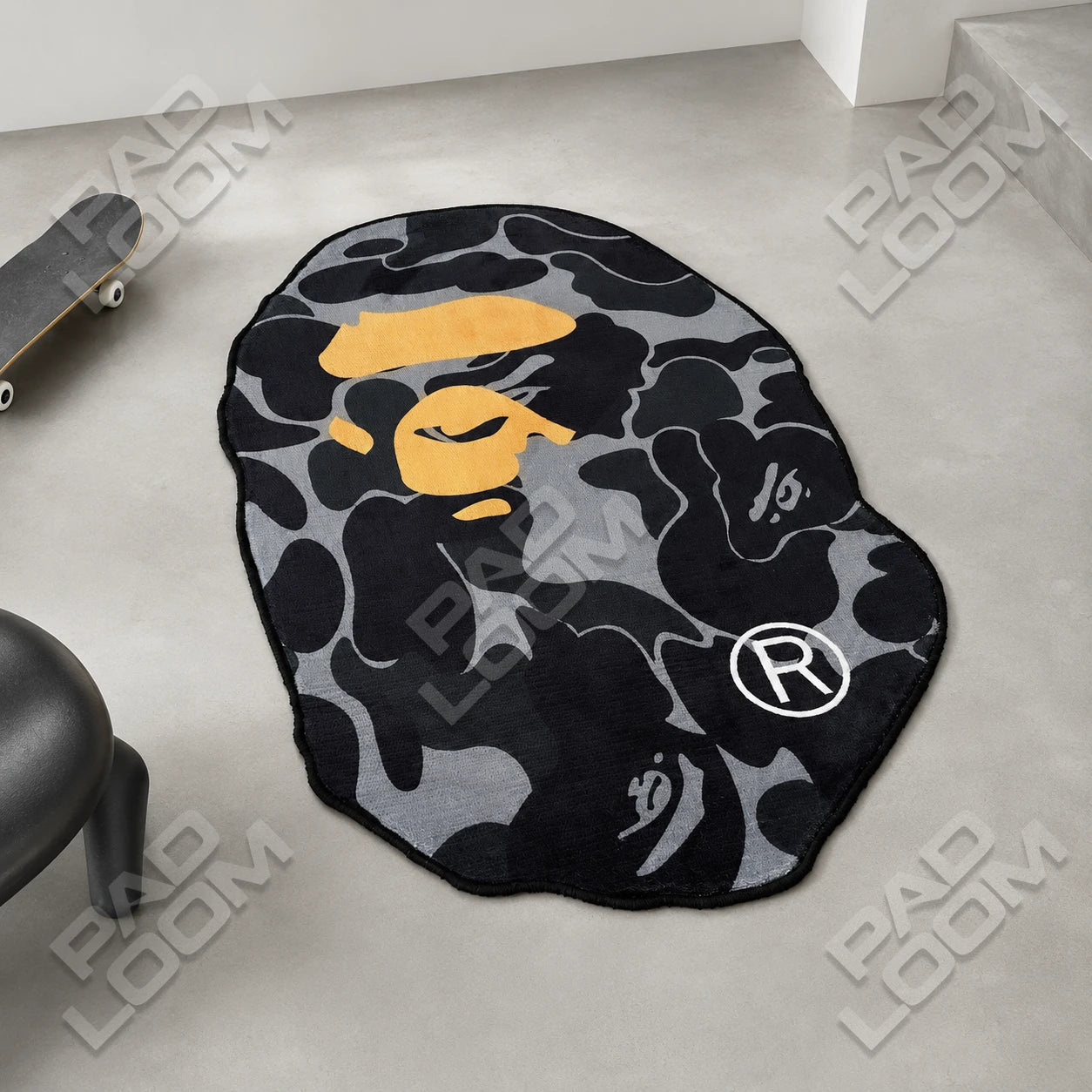 Black Bape shaped rug shown in a room setting