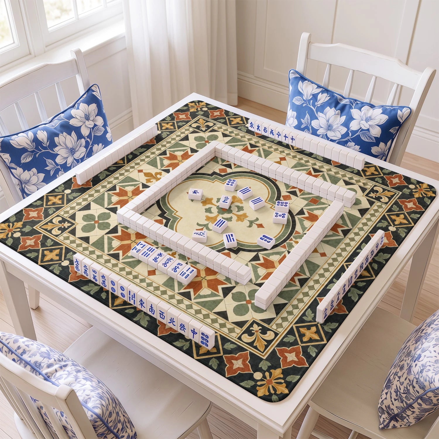 Blue Aztec Kilim mahjong mat with tiles and racks on the table