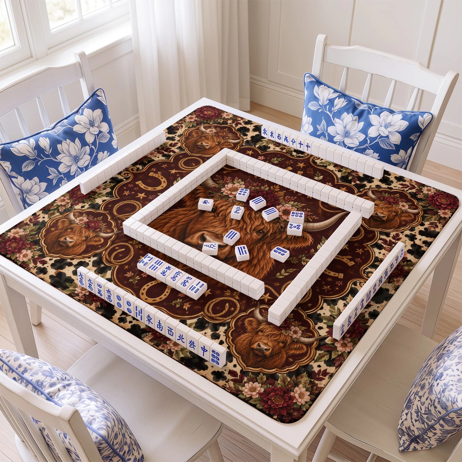 Burgundy Highland mahjong mat with tiles and racks on the table