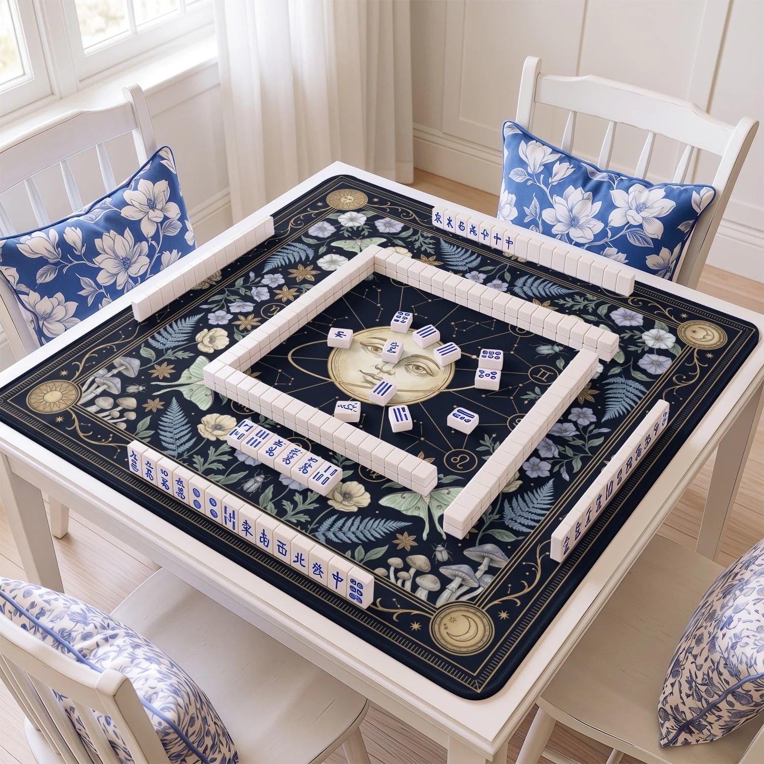 Celestial Zodiac mahjong mat with tiles and racks on the table