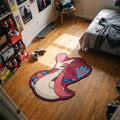 Coiled Milotic shaped rug on wood flooring beside a bed