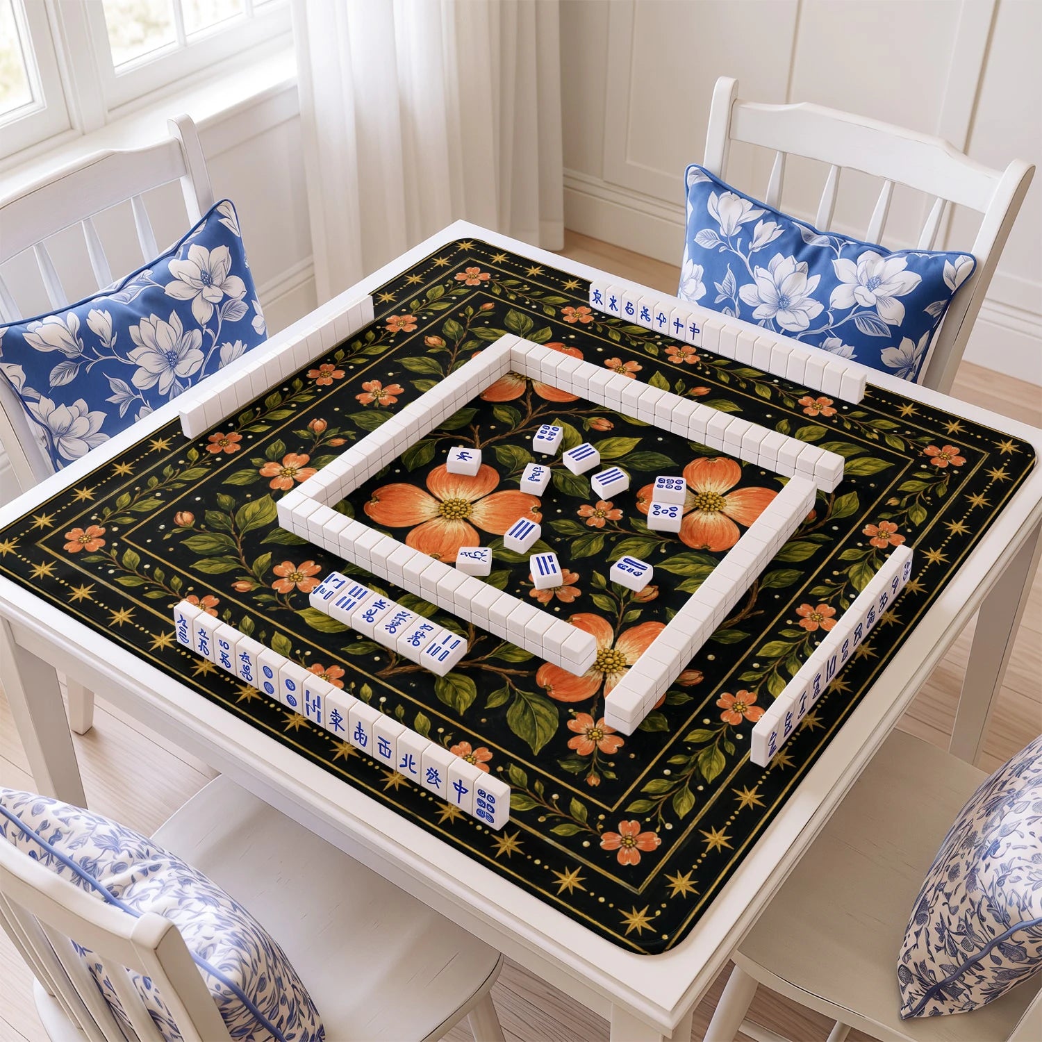 Coral Dogwood mahjong mat with tiles and racks on the table