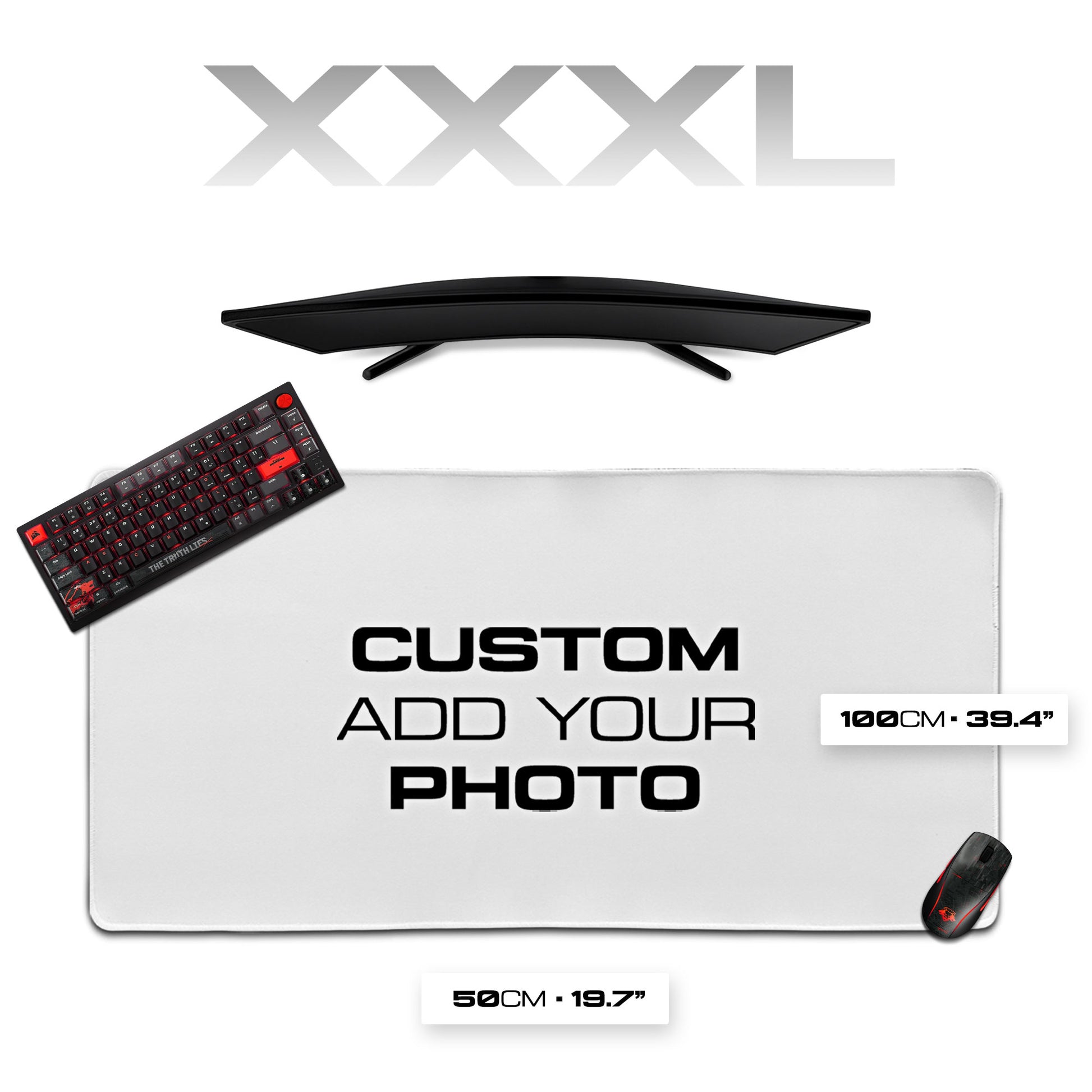 Gaming desk setup with monitor, keyboard, mouse, and large mouse pad on a white background.