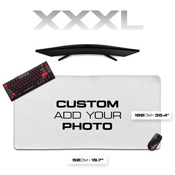 Gaming desk setup with monitor, keyboard, mouse, and large mouse pad on a white background.