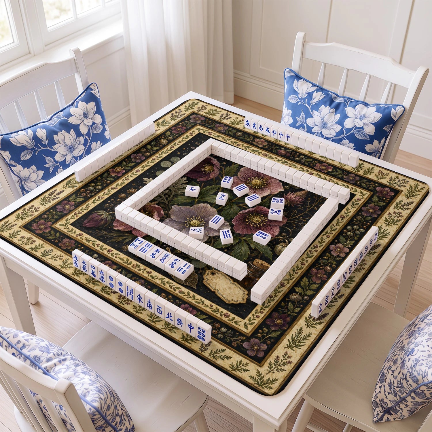 Dark Hellebore mahjong mat with tiles and racks on the table