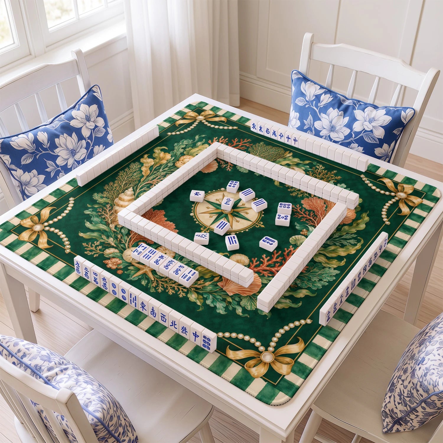 Emerald Coral mahjong mat with tiles and racks on the table