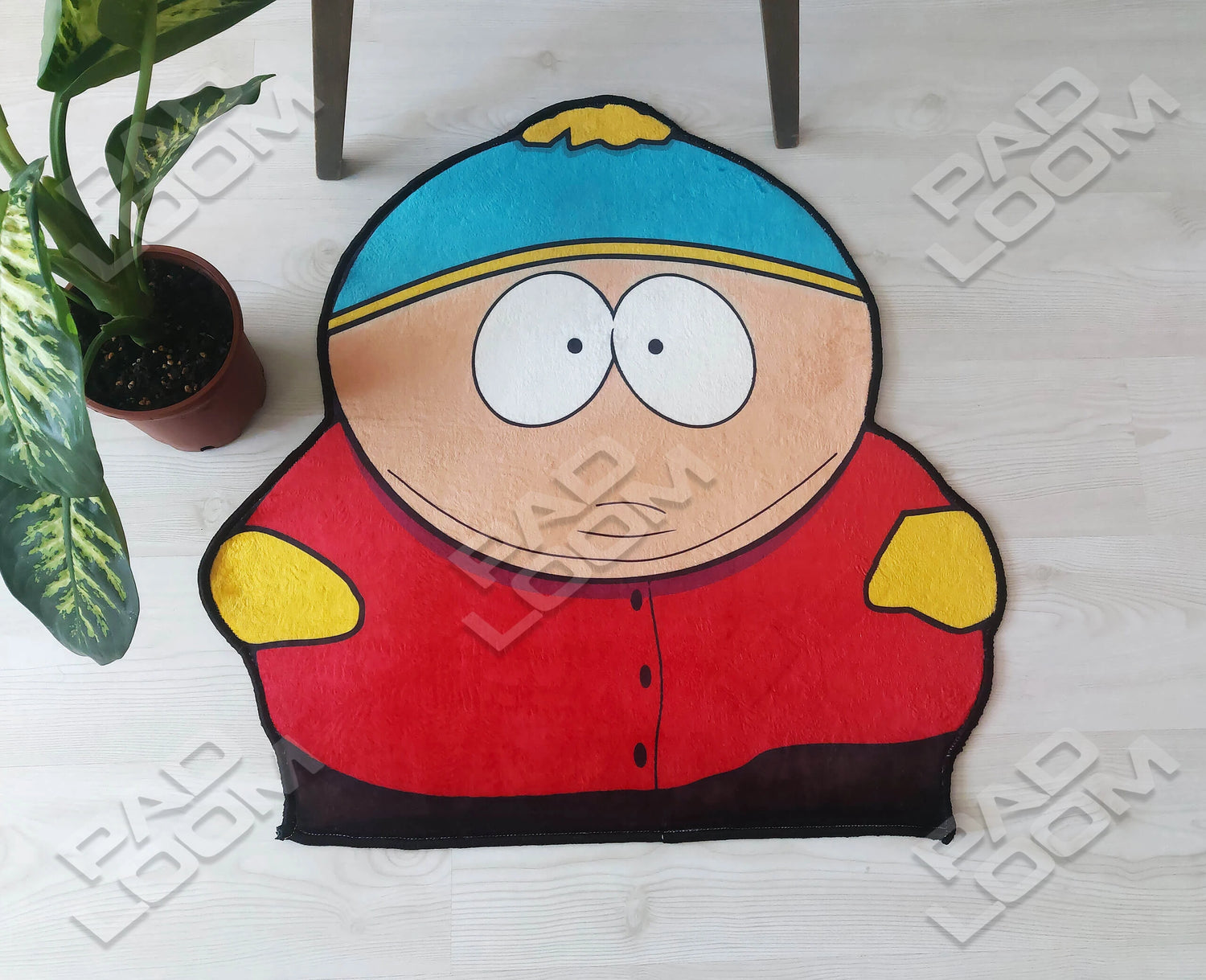 Eric Cartman shaped rug shown in a room setting