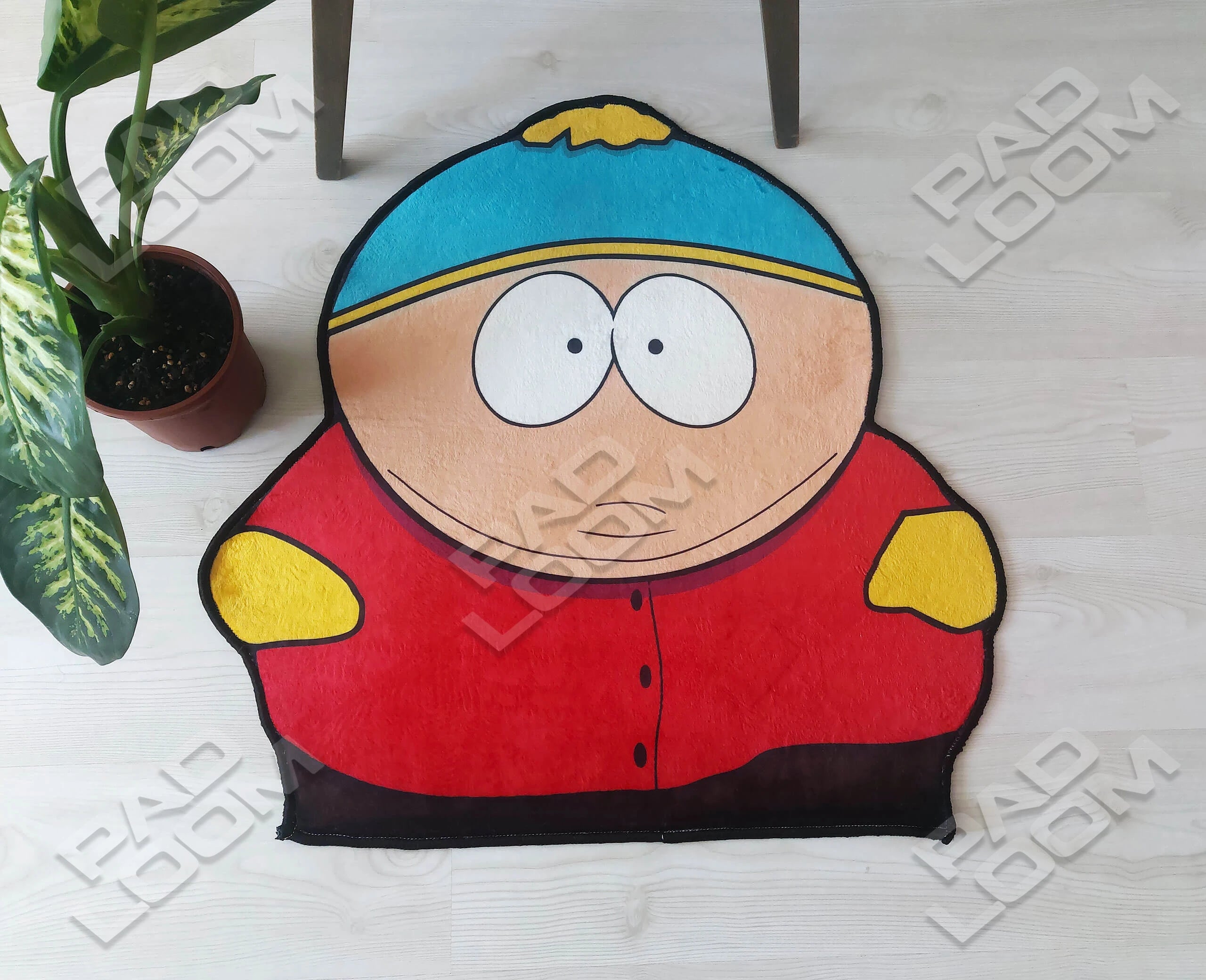 Eric Cartman shaped rug shown in a room setting