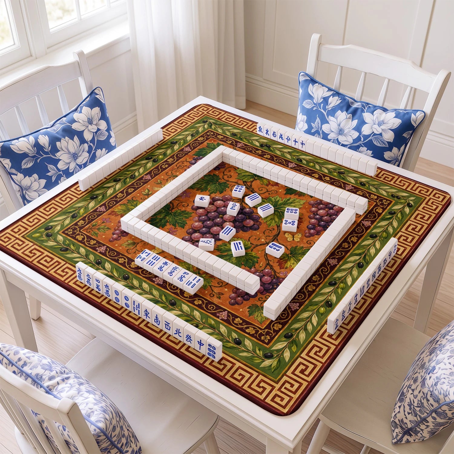 Grapevine mahjong mat with tiles and racks on the table