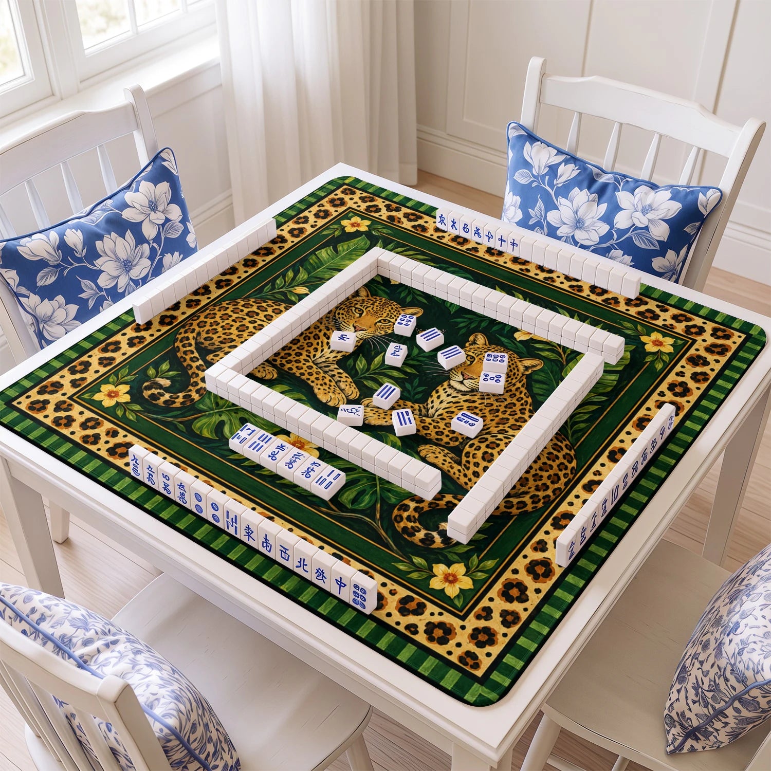 Green Leopard mahjong mat with tiles and racks on the table