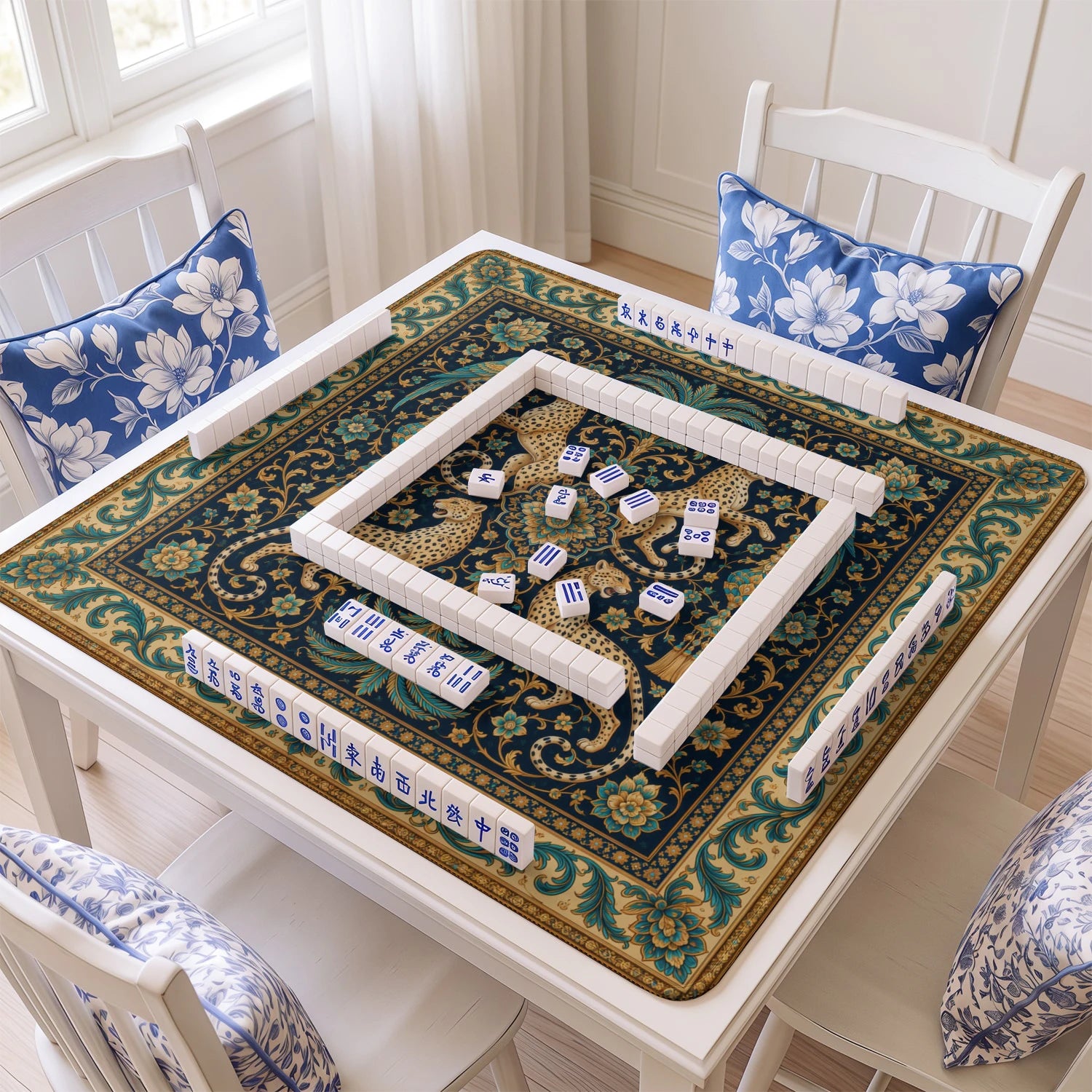 Indigo Leopard mahjong mat with tiles and racks on the table