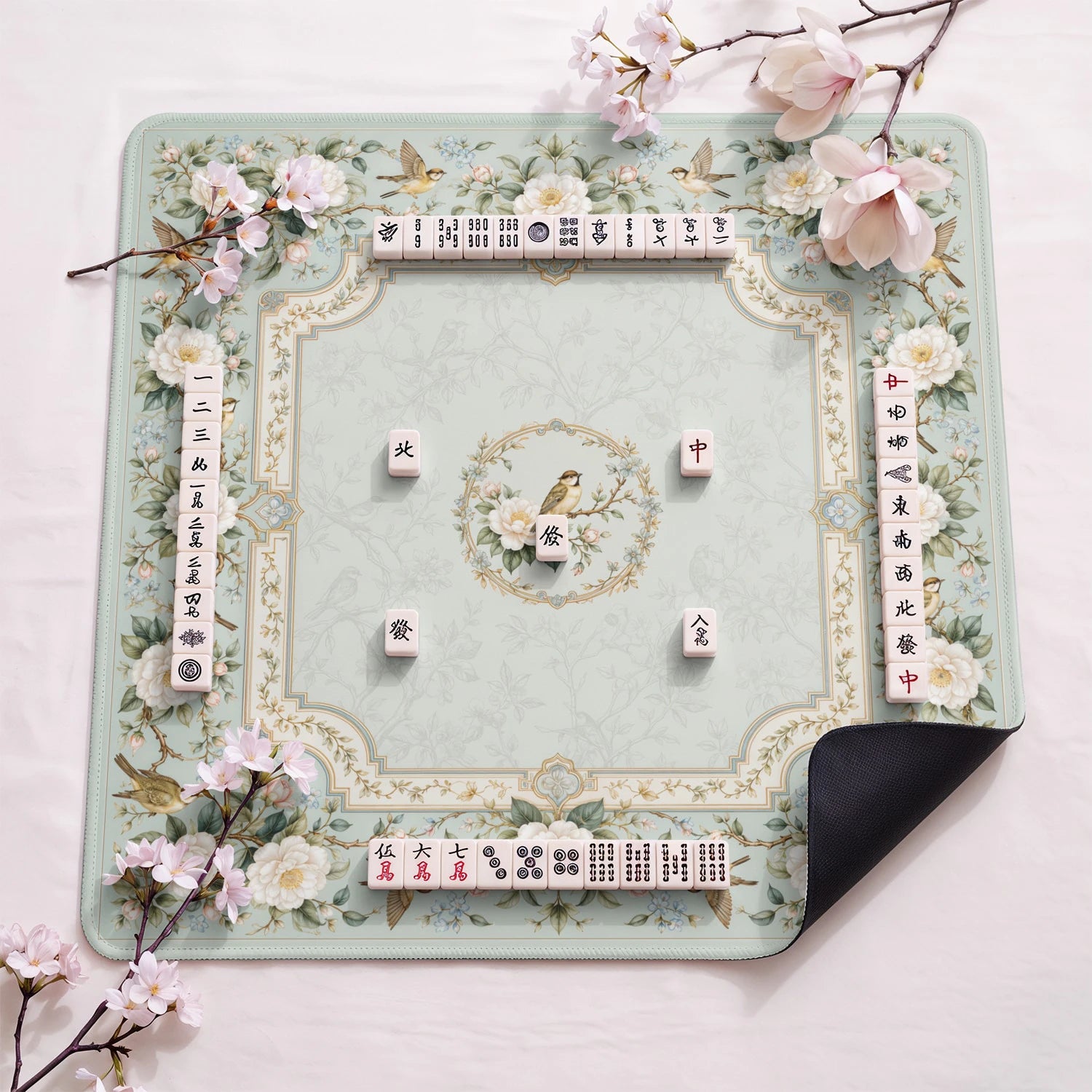 Ivory Camellia design close-up on mahjong mat surface