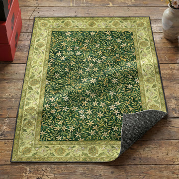 Jasmine thicket green garden area rug with white star flowers on dense emerald foliage field