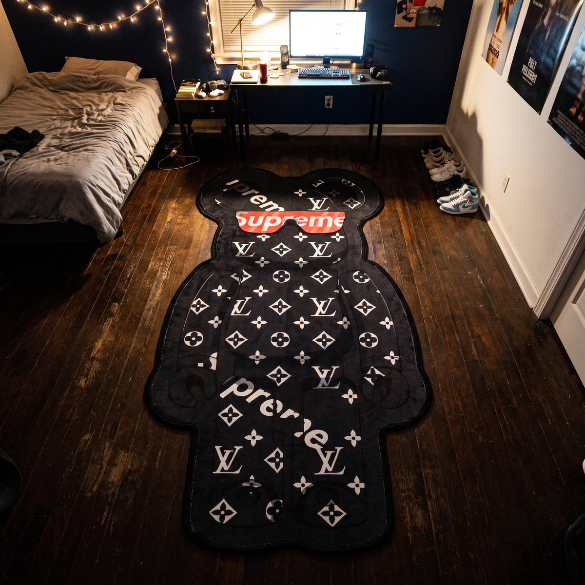 Angled overhead view of the LV Bearbrick shaped area rug in a bedroom