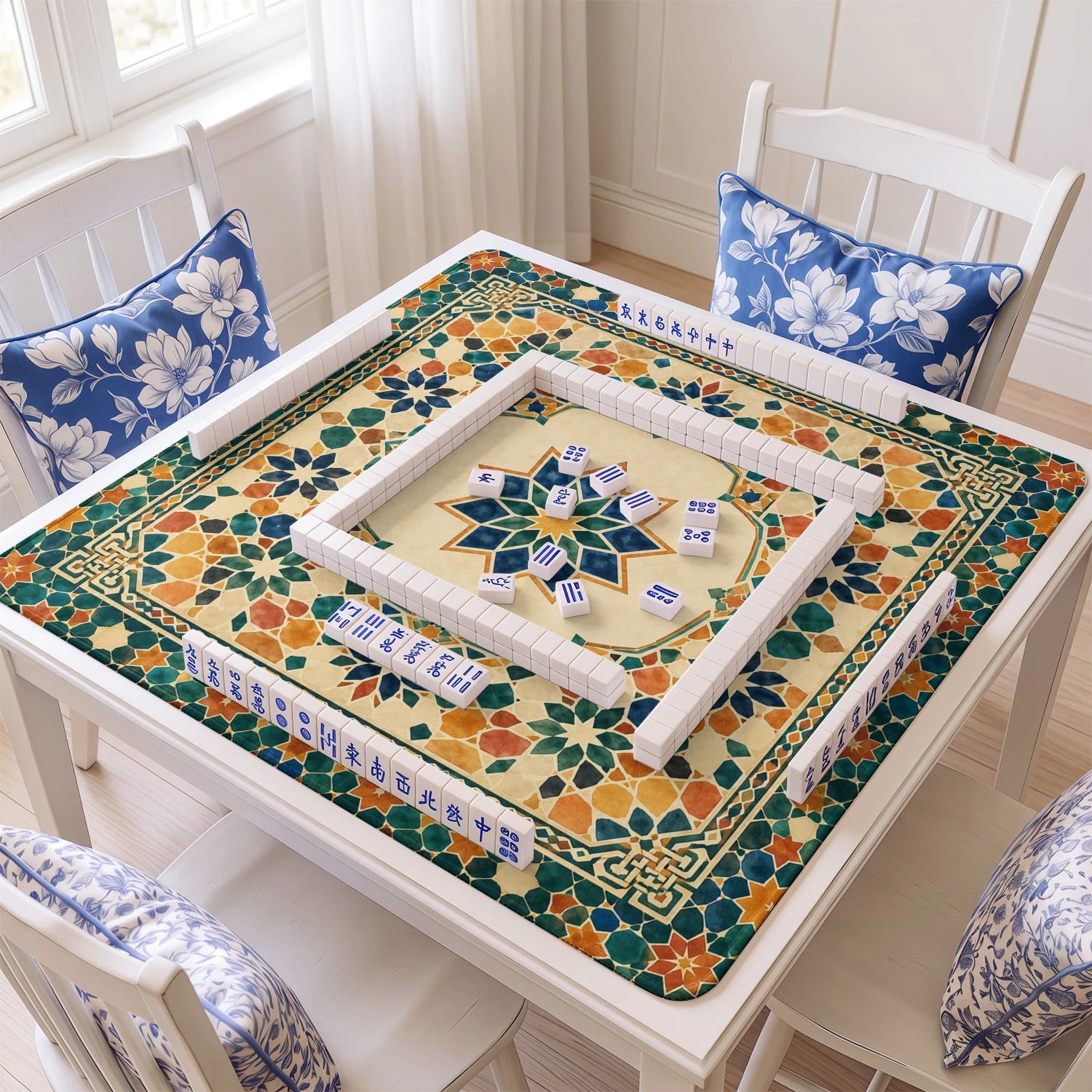 Moroccan Mosaic Star mahjong mat with tiles and racks on the table