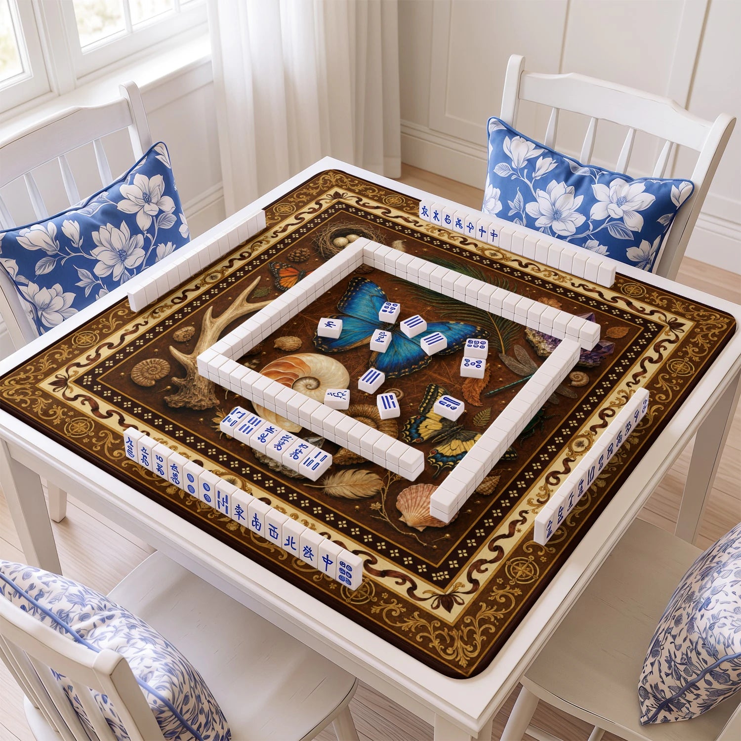 Naturalist Curiosities mahjong mat with tiles and racks on the table