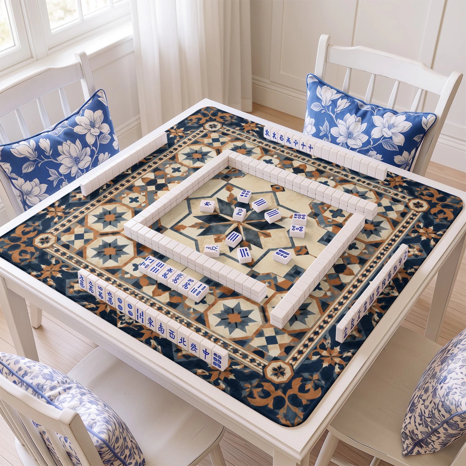 Navy Moroccan Star mahjong mat with tiles and racks on the table