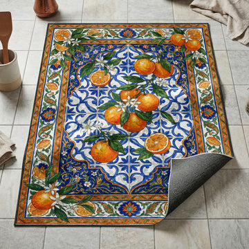 Bright oranges with white blossoms kitchen mat on blue azulejo tile and citrus ornamental border