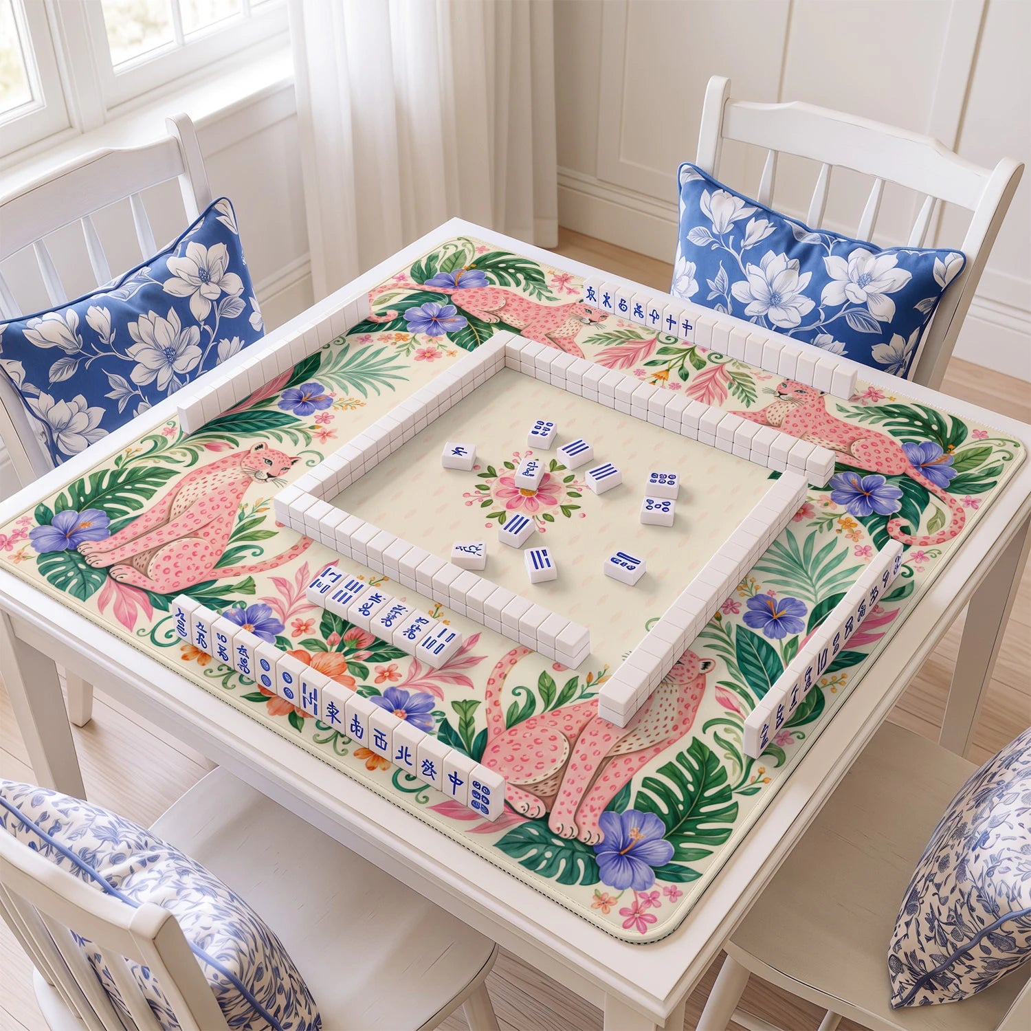 Pink Leopard mahjong mat with tiles and racks on the table