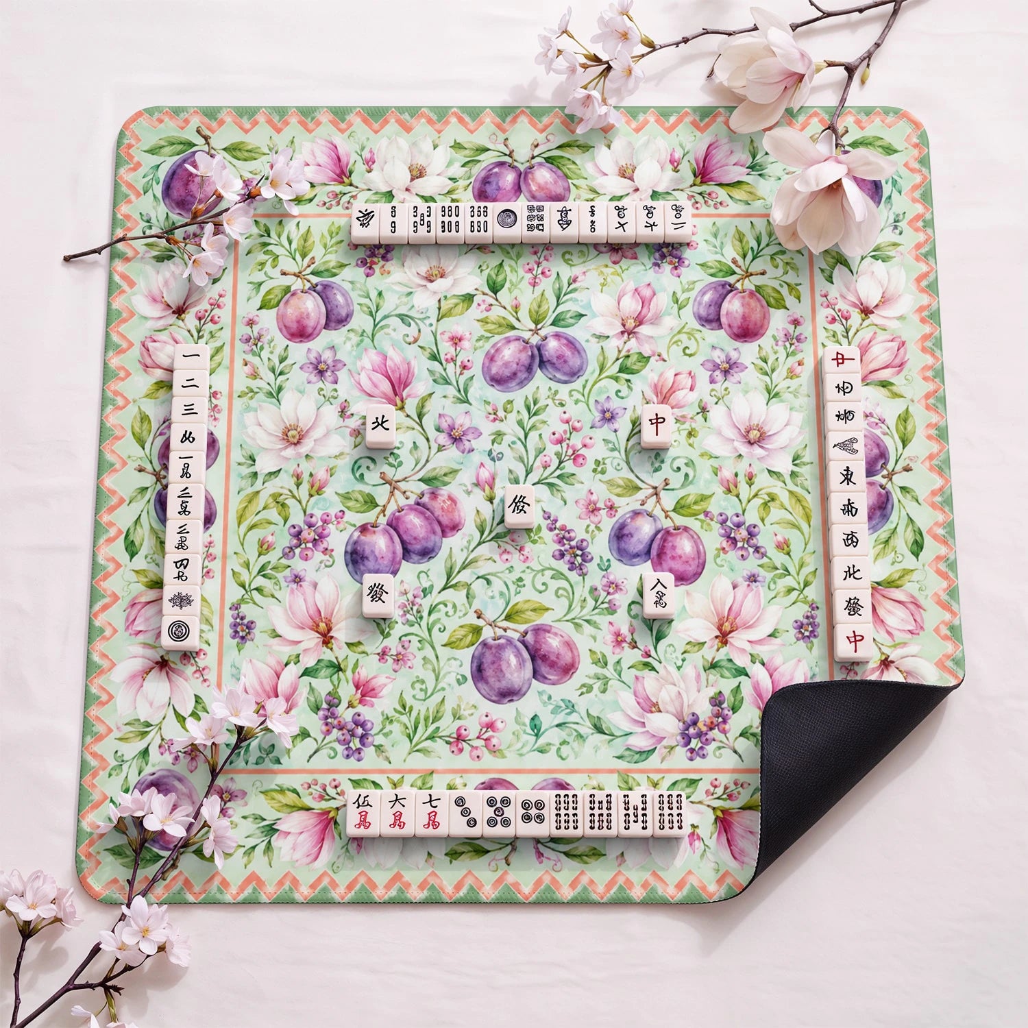 Plum Magnolia design close-up on mahjong mat surface