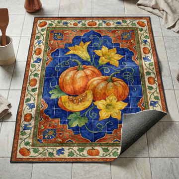 Pumpkin harvest kitchen mat with pumpkins blossoms and vines on cobalt blue tile ornamental border