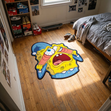 SpongeBob shaped rug on wood flooring beside a bed