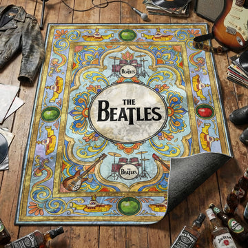 The Beatles bass drum logo area rug with yellow submarines green apples and guitars on colorful tapestry