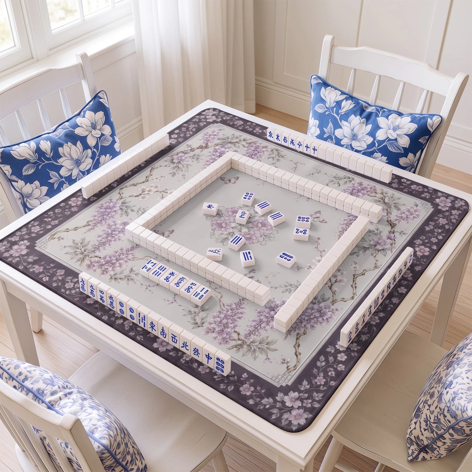 Wisteria Grey mahjong mat with tiles and racks on the table
