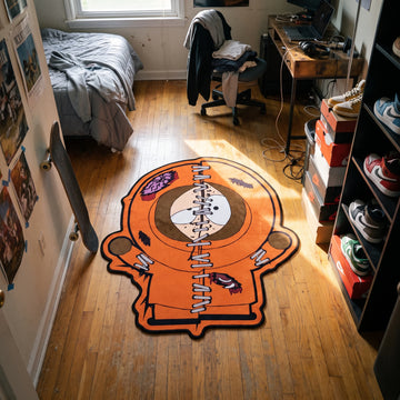 Zombie Kenny shaped rug on a hardwood bedroom floor